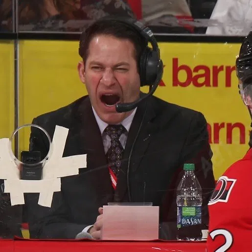 Stu on the mic as an arena announcer